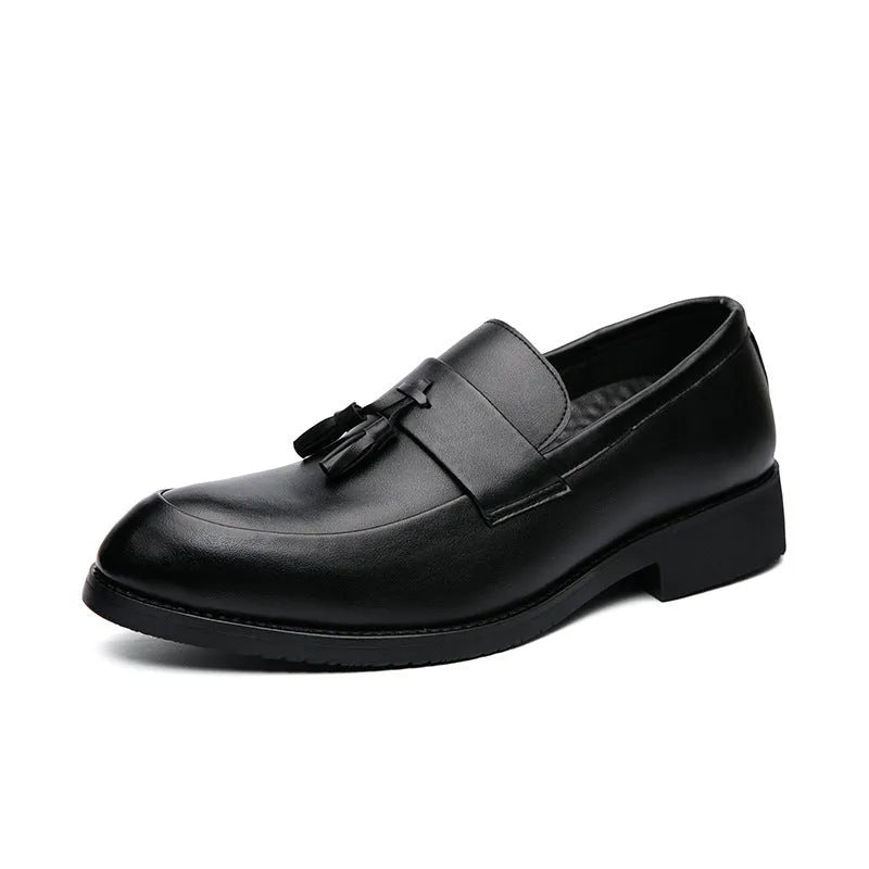 Men's black and brown slip-on business casual shoes with tassel detail and rubber sole.