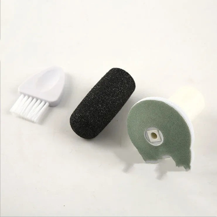 USB rechargeable electric foot file with three replacement rollers for callus and nail care, silver white ABS body on a clean surface