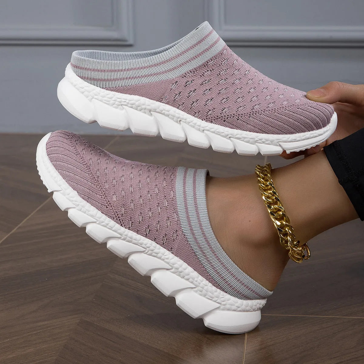 Women's black striped Flyknit slipper shoes with a height-increasing sole on a plain background