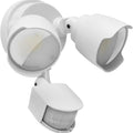 White outdoor LED flood light with motion sensor mounted on wall