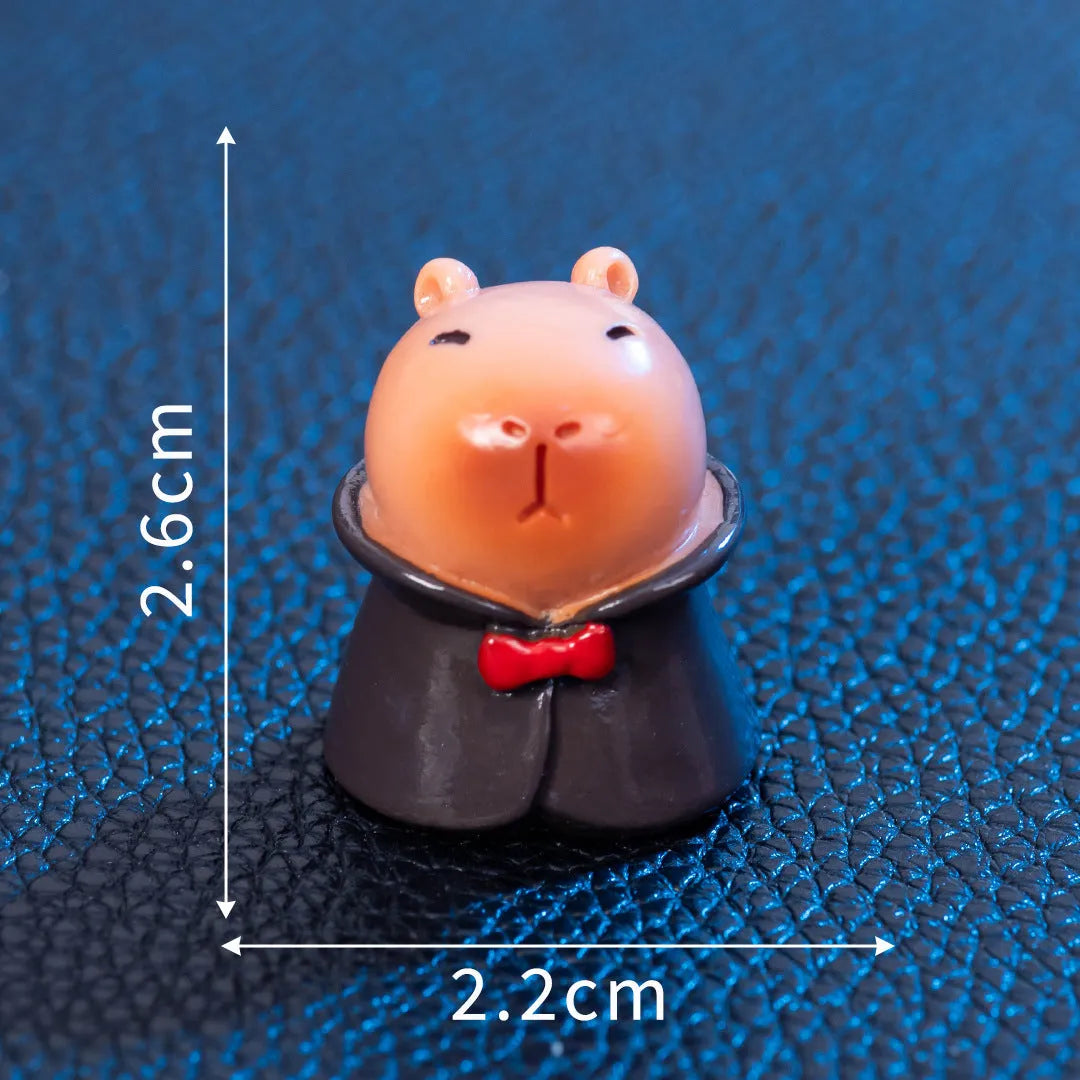 Eight different Halloween-themed capybara resin figurines displayed together