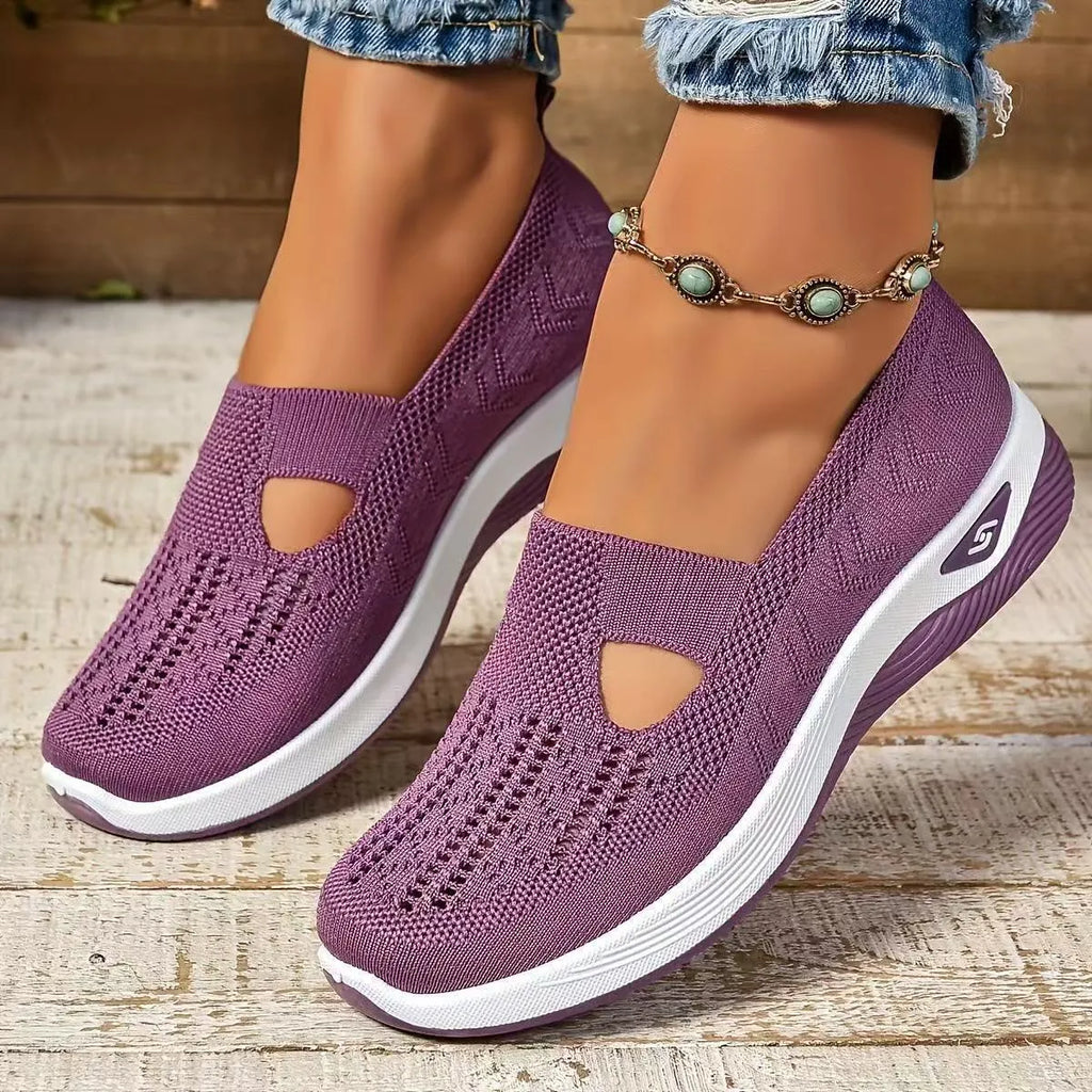 Women's light grey mesh casual flats with a T-strap and round toe on a soft PVC sole.