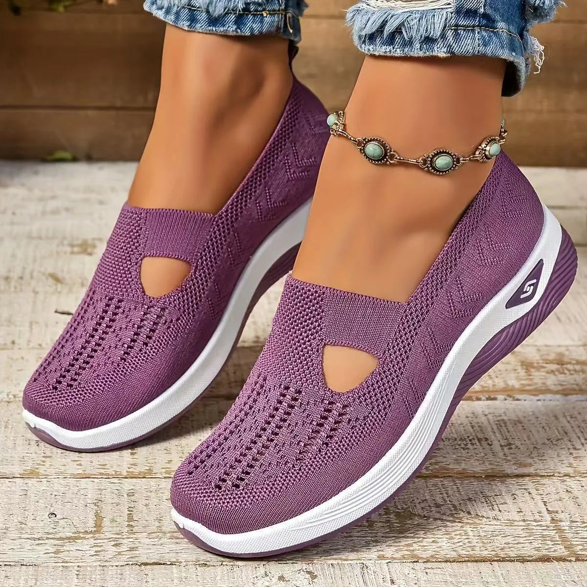 Women's light grey mesh casual flats with a T-strap and round toe on a soft PVC sole.
