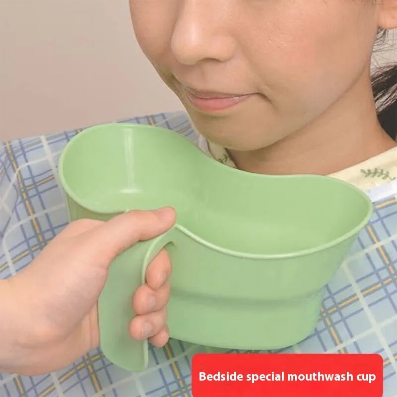 Green plastic gargle cup for elderly patient oral care assistance
