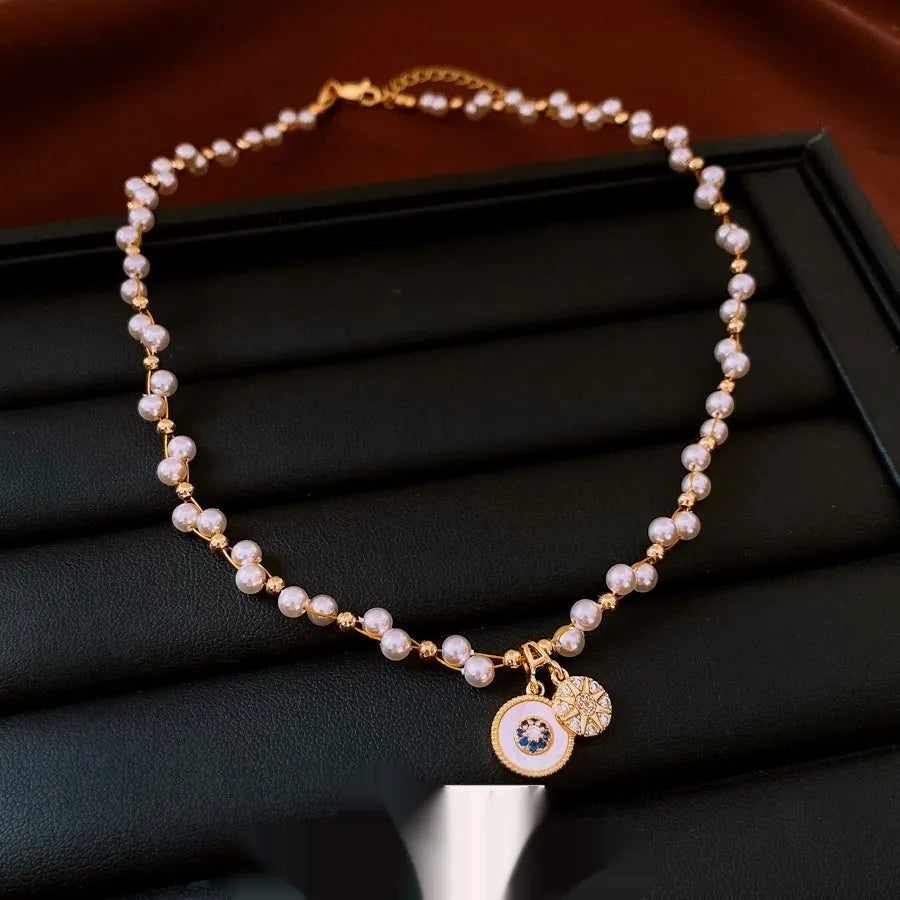 Gold electroplated women's necklace with round pearl pendant and adjustable clavicle chain
