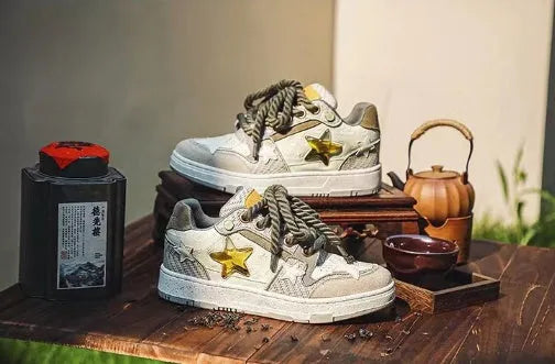 Green casual sneakers with star pattern and round toe design