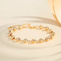 Gold electroplated copper unisex retro beaded bracelet on a neutral background