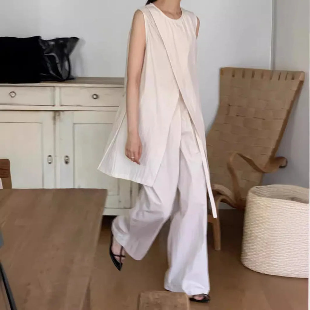 Split sleeveless lace-up top and high waist wide leg pants two-piece set in light apricot or black, average size