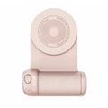 Black magnetic camera handle phone bracket with rotatable grip on wooden table