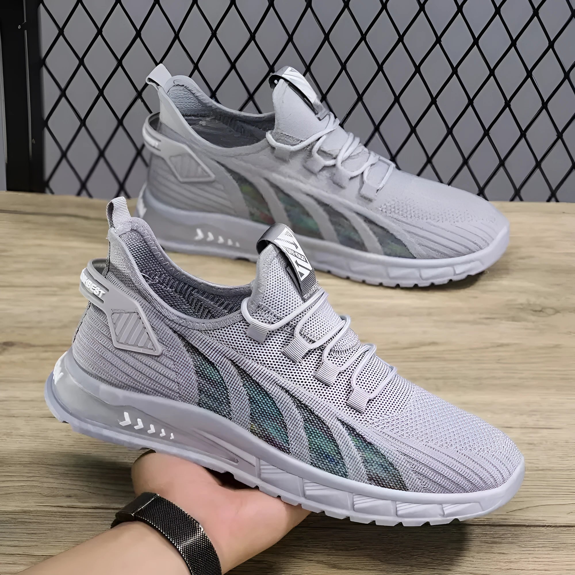 Lightweight low-top mesh sneaker in a neutral colour on a flat plastic sole.