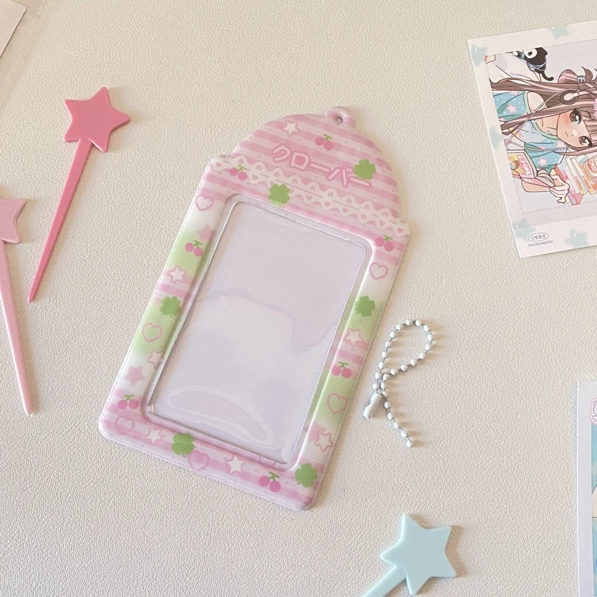 Cartoon PVC meal card holder pendant on a chain, showing strawberry and four-leaf clover design options.