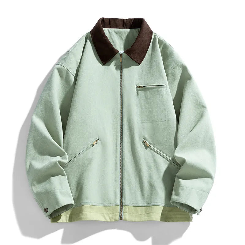 Man wearing a mint green loose fit polyester couple jacket with contrast lapels and side seam pockets.