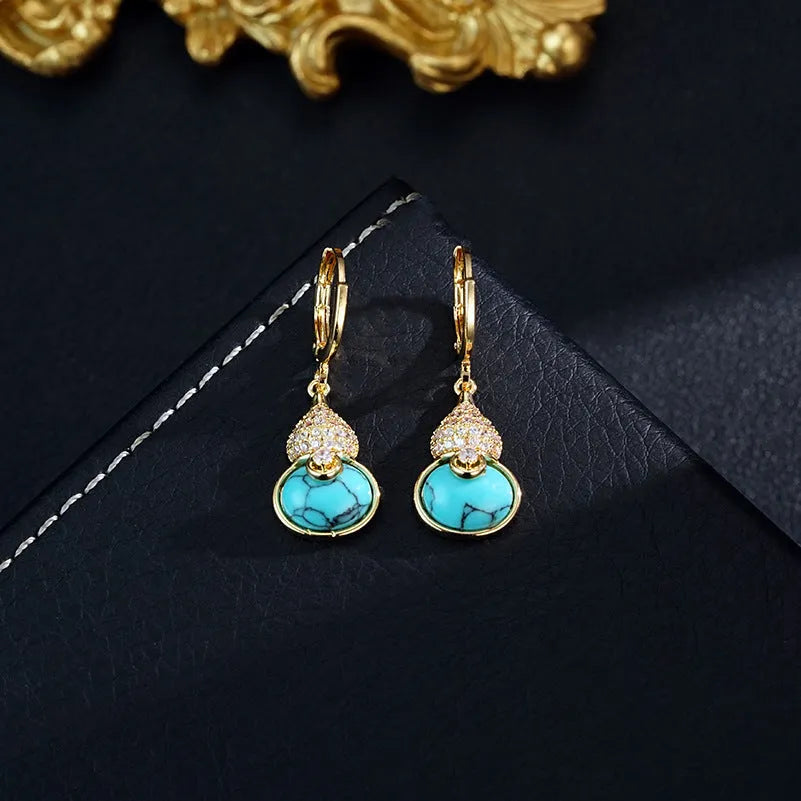 Turquoise gourd flower shape earrings and necklace set on display showing 18K gold plated brass finish