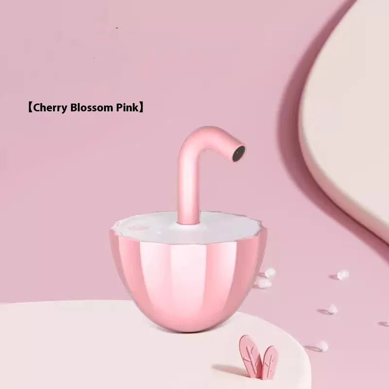 Bubble tea cup shaped interactive laser cat toy with cherry blossom pink finish on floor