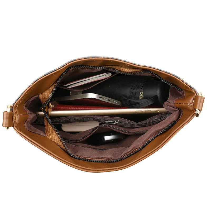 Brown soft leather messenger bag with front pocket and shoulder strap