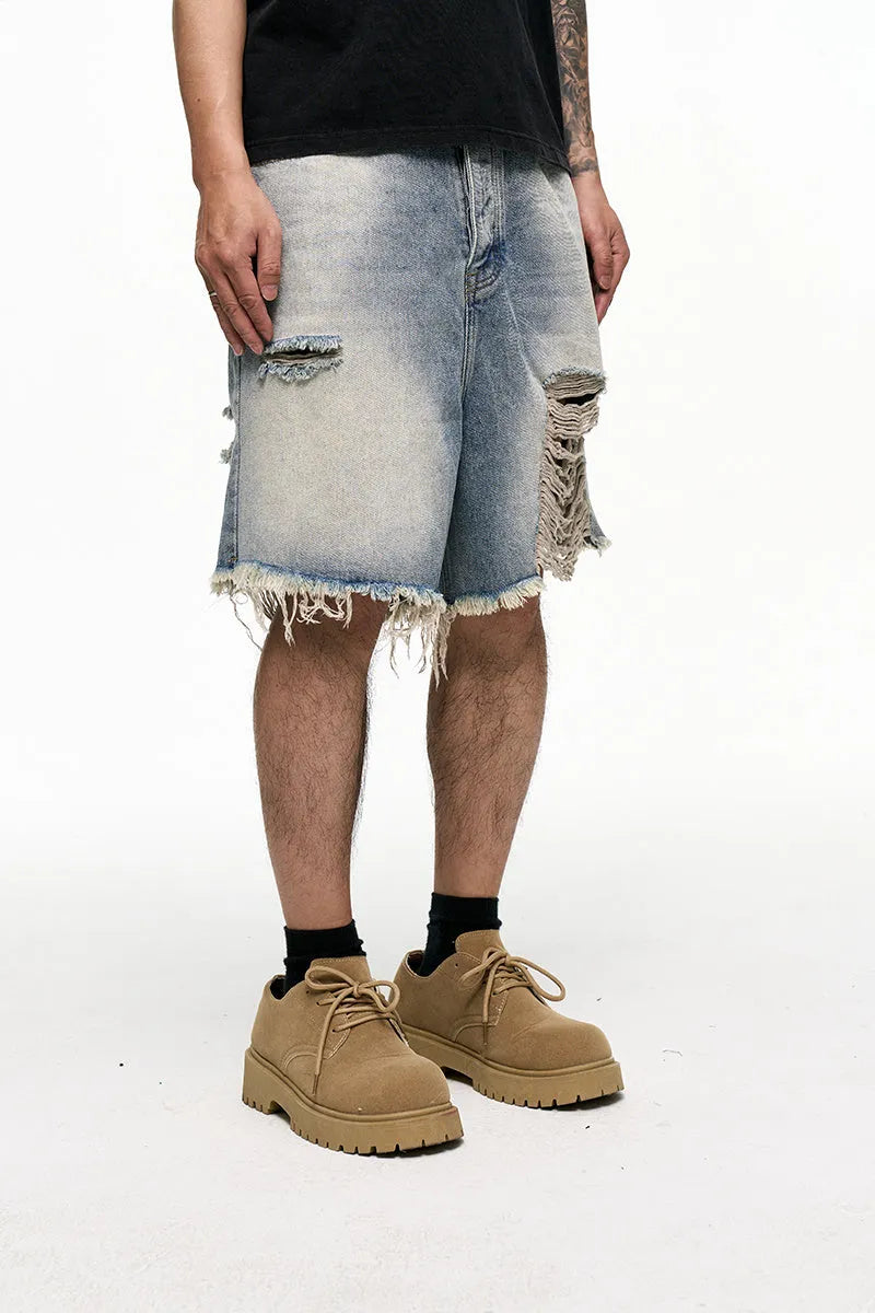 Light blue men's baggy retro denim shorts on a mid waist, showing wide leg and fifth pants length