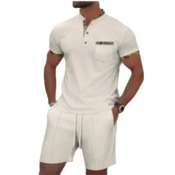 Man wearing a grey short sleeve zippered polo top and matching shorts, a casual cotton blend suit set.