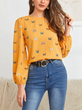 Green women's long sleeve shirt with butterfly print, showing loose fit and button front.
