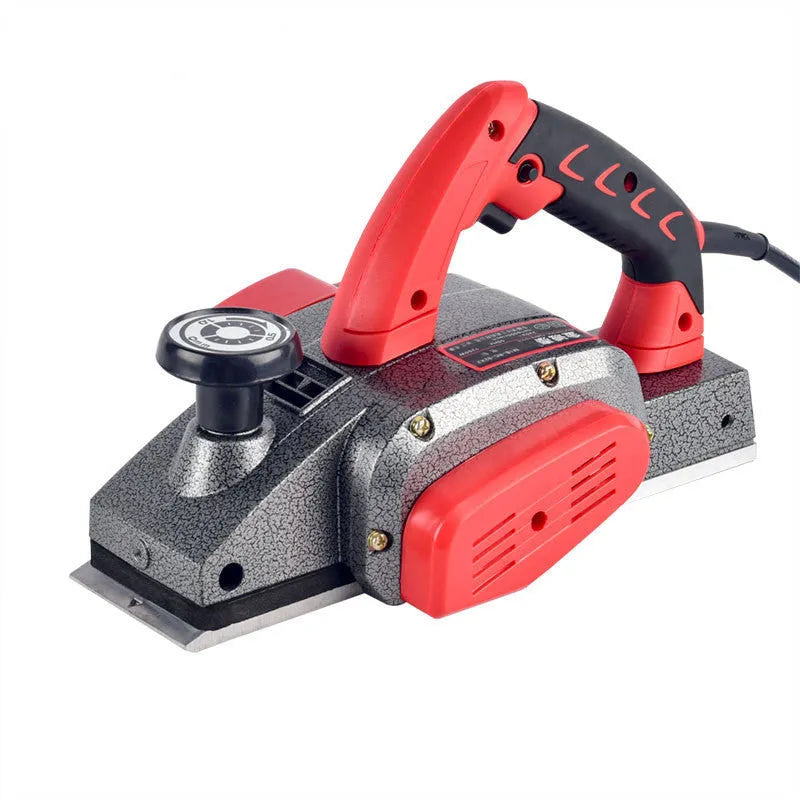 Red desktop electric wood planer with aluminium body, showing 82mm planing width