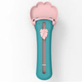 Green and pink pet feed spoon with squeeze mechanism for dispensing liquid food and treats