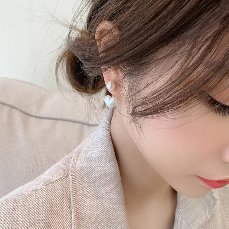 Pair of women's heart-shaped alloy stud earrings with artificial gemstone inlay, Korean style.