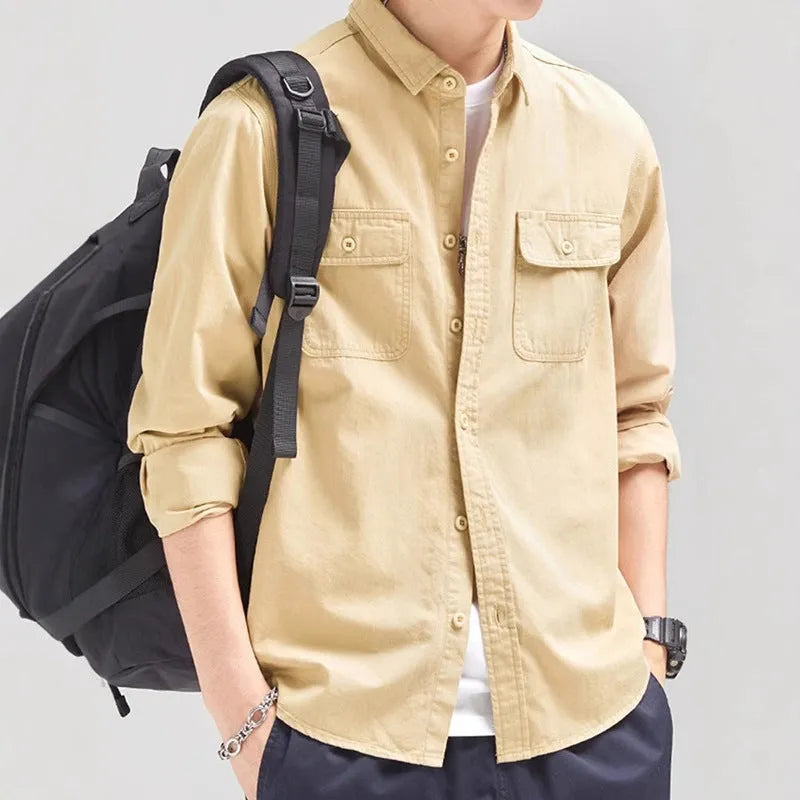 Men's light grey loose fit long sleeve overalls shirt with cardigan style on a hanger