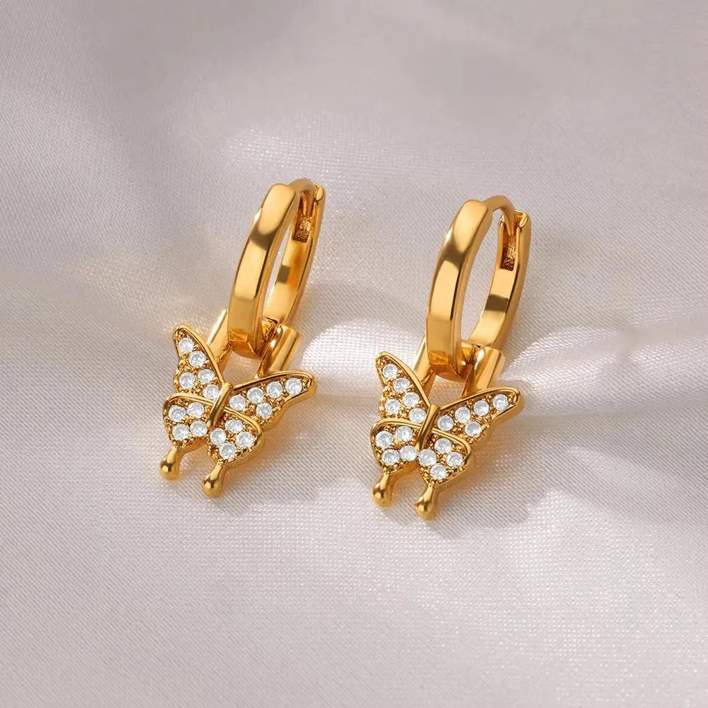 Women's copper butterfly earrings with heart and star geometric details in various colours.