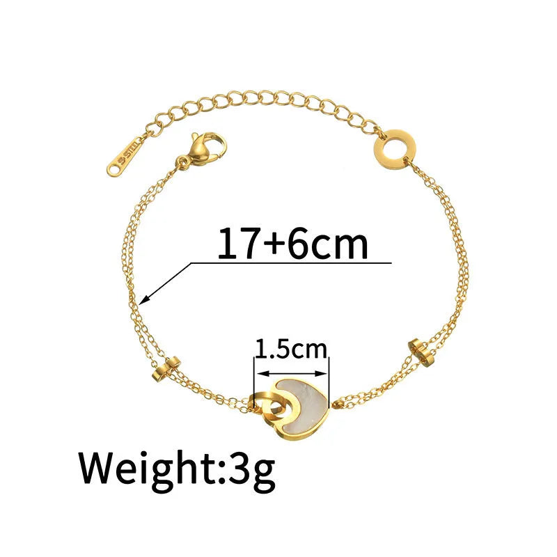 Silver stainless steel bracelet with a double-layer heart pendant featuring dark resin insets