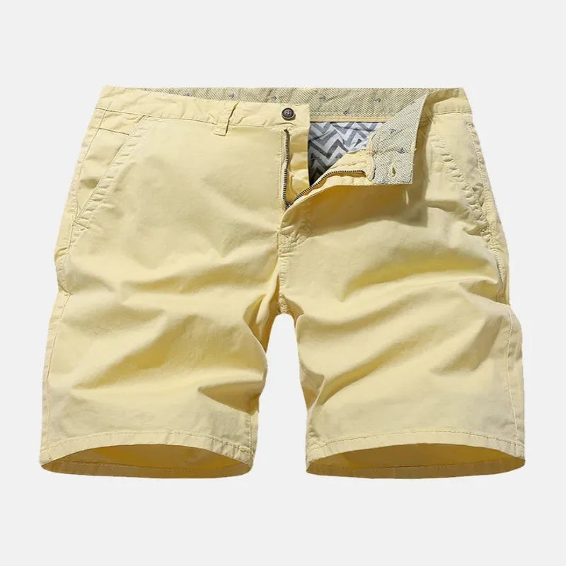 Men's blue denim casual shorts with a loose straight leg and elasticated waistband on a white background.