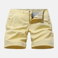 Men's blue denim casual shorts with a loose straight leg and elasticated waistband on a white background.
