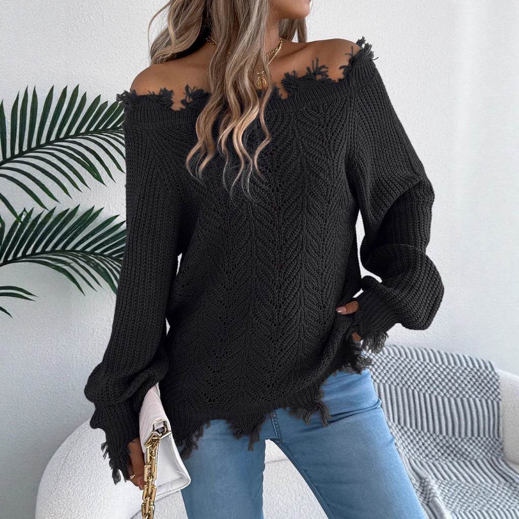 White women's pullover sweater with cut-off-the-shoulder neckline and hollow-out patterned long sleeves.