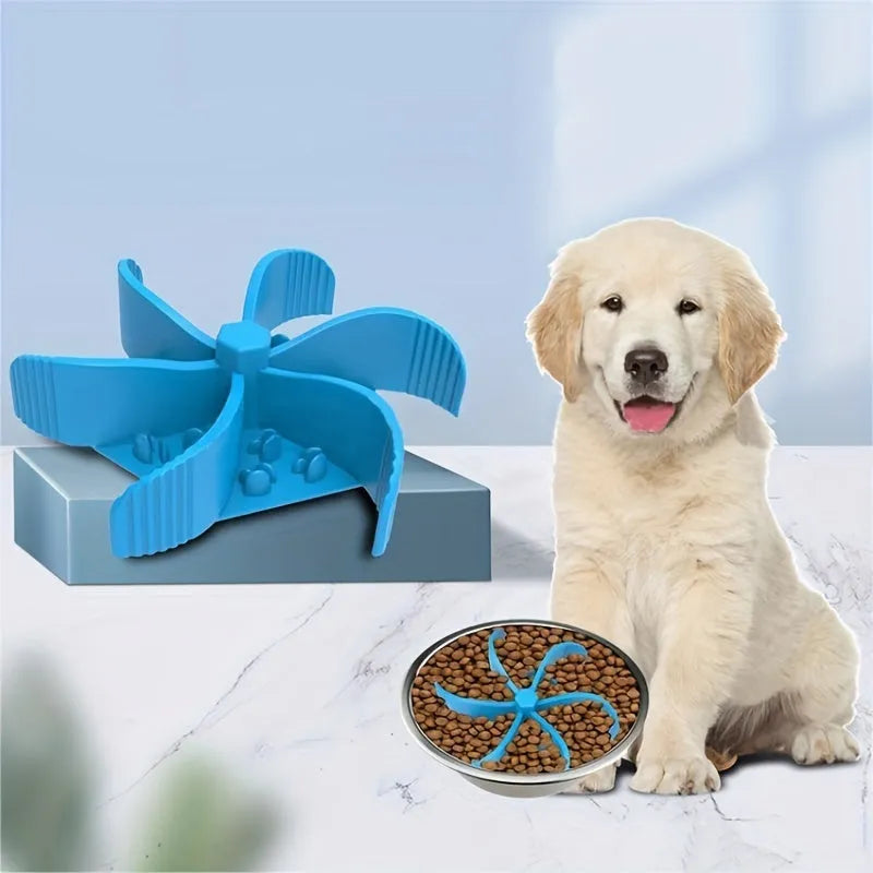 Silicone pet slow food device with sucker cup in green colour on a smooth floor