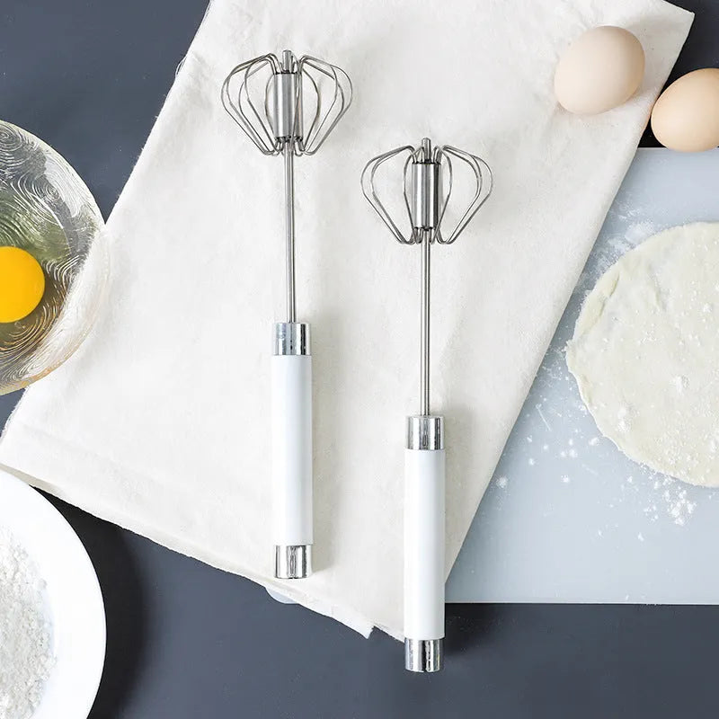 Semi-automatic stainless steel egg beater whisk with hand pressure rotating mechanism in silvery colour