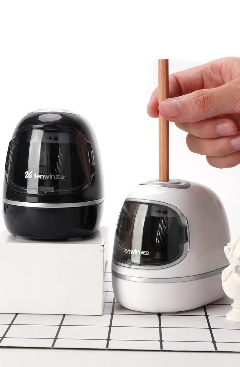 Creative electric pencil sharpener three-speed geometric plastic body black colour on desk