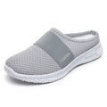 Women's black mesh casual flat shoes with hollow out design and round toe.