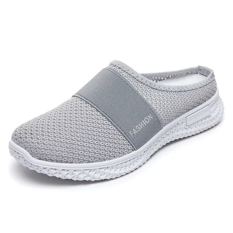 Women's black mesh casual flat shoes with hollow out design and round toe.