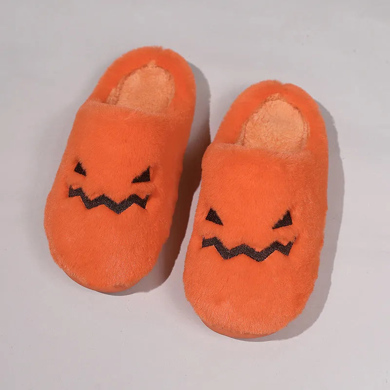Orange plush Halloween pumpkin slippers with coral velvet upper and flat PVC sole.