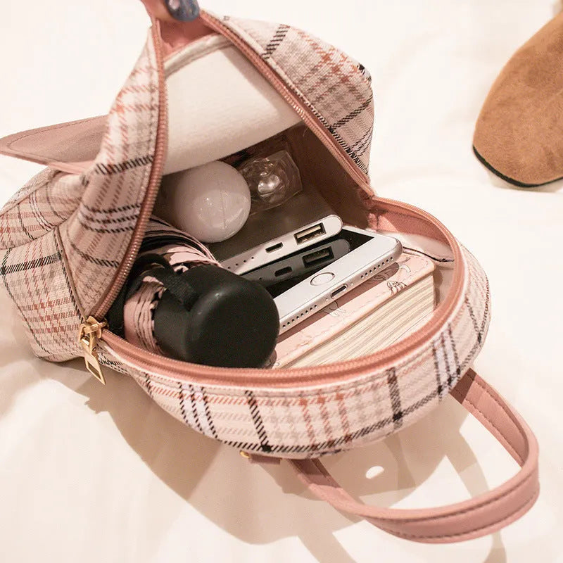 A PU phone bag shown in one of five colour options, demonstrating diagonal shoulder carry.