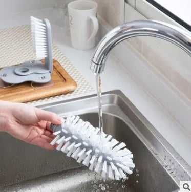 Grey rotating double-headed cup brush with suction cups for wall attachment