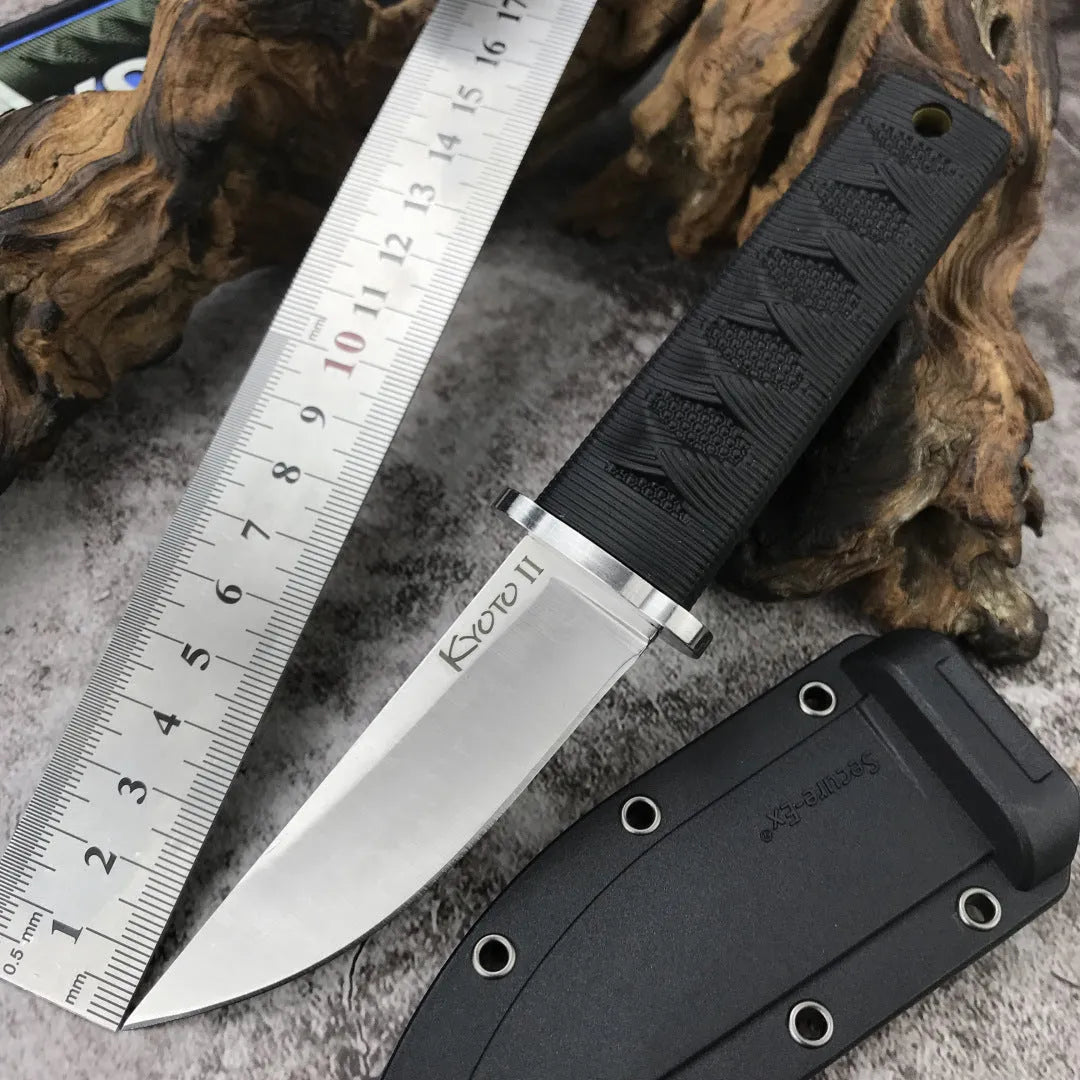 Wild mini straight knife with 440C steel blade, ABS handle, and nylon sheath on outdoor background