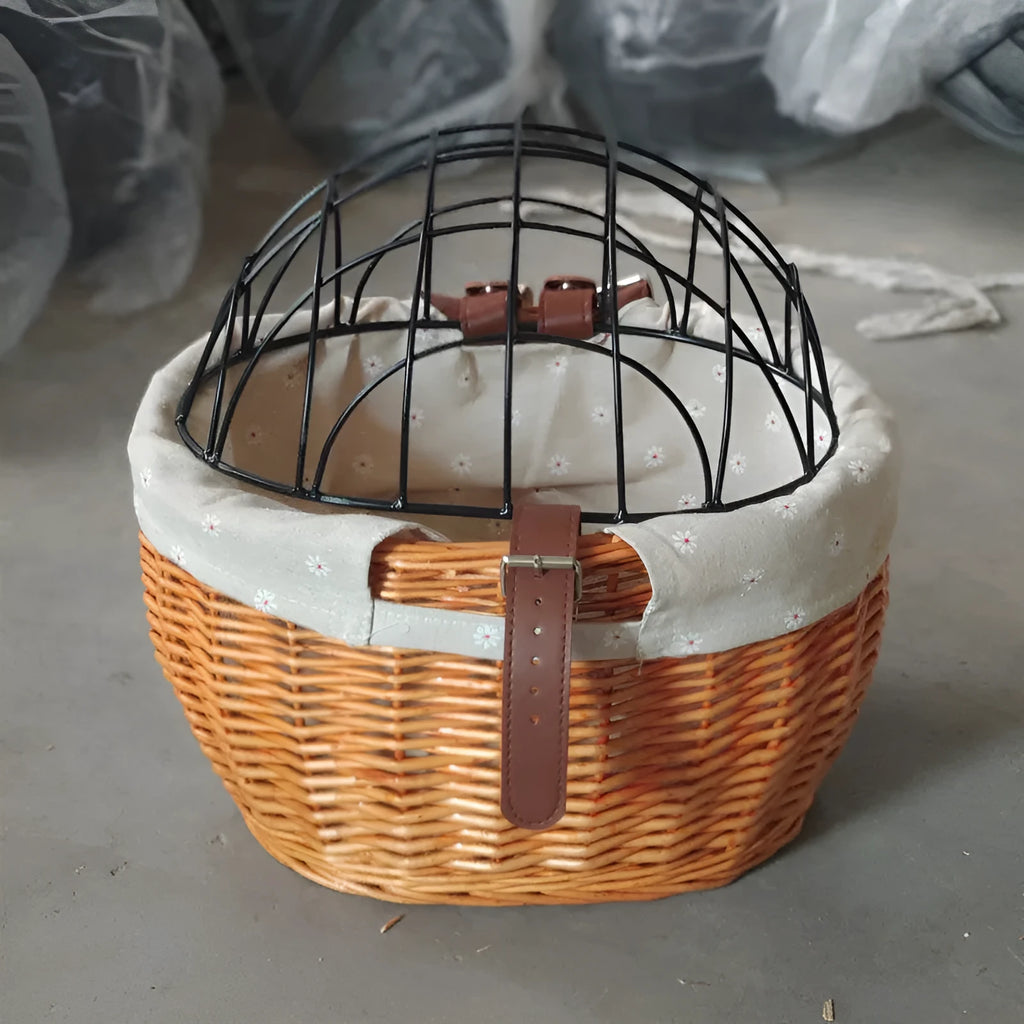 Medium honey-coloured wicker bicycle front basket for small cats and dogs on a road bike handlebar