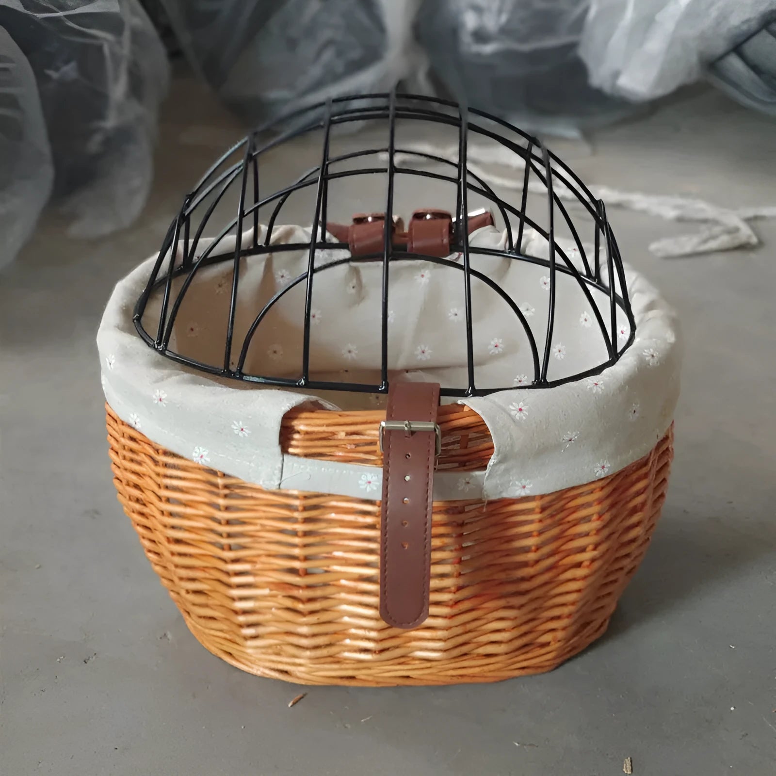 Medium honey-coloured wicker bicycle front basket for small cats and dogs on a road bike handlebar