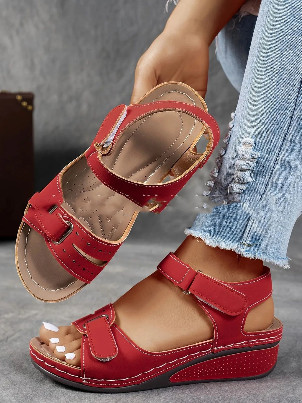 Women's beige strap sandals with a thick composite sole and adjustable Velcro fastening.