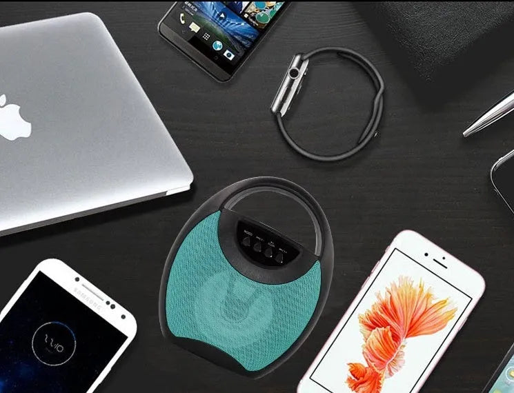 Portable Bluetooth speaker in black, blue, or pink with USB port and SD card slot