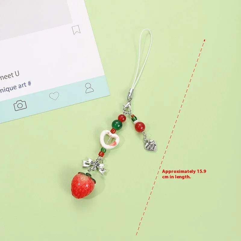 Fruit mobile phone charm keychain with apple, strawberry designs on plastic/resin with rope attachment