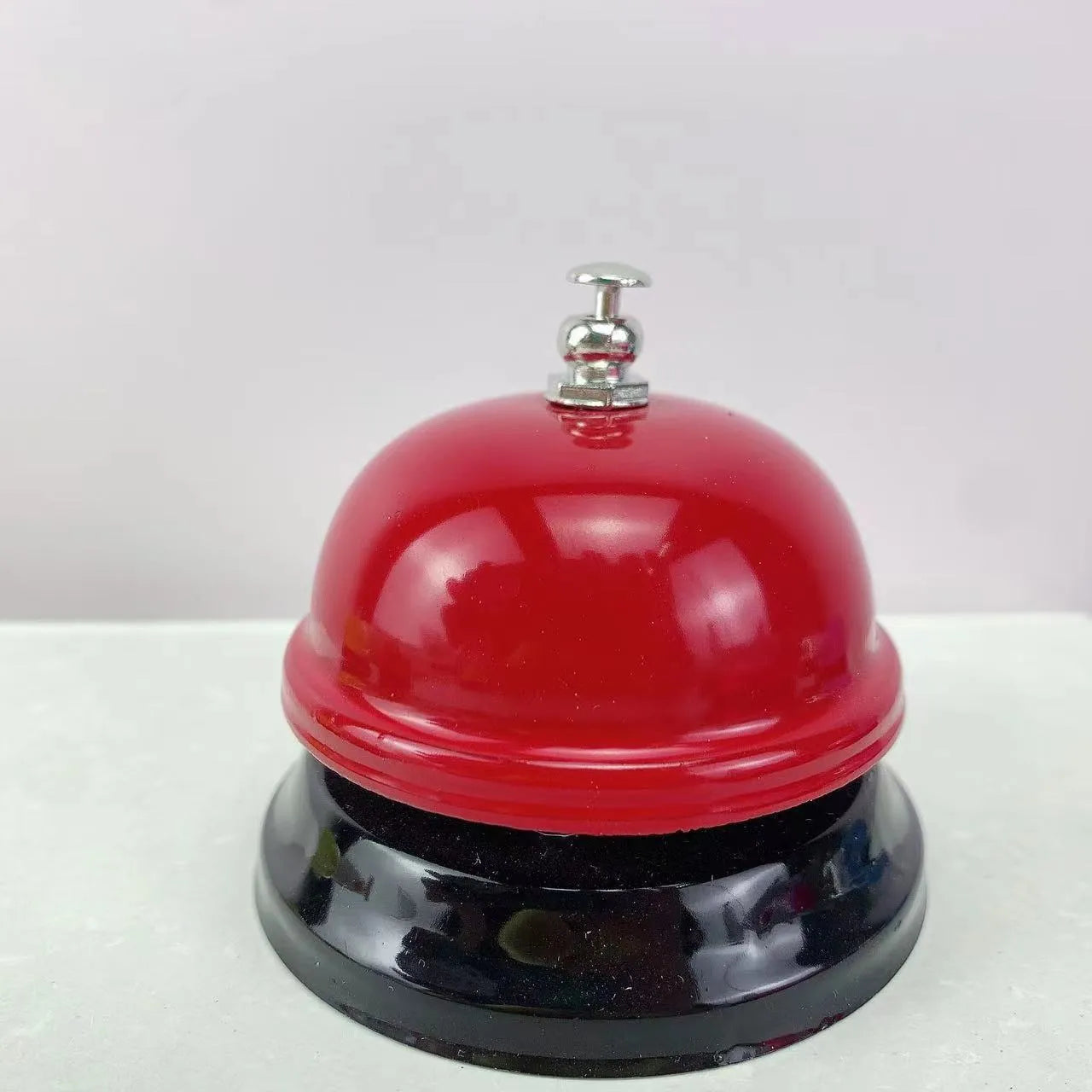Iron handheld bell in selected colour for classroom games or restaurant service.