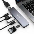 Compact aluminium USB-C hub showing ports: Thunderbolt 3, USB-C PD, HDMI, SD card slot, and two USB 3.0