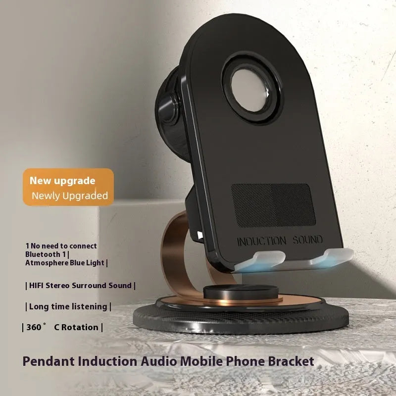 Black Gold folding Bluetooth mobile phone stand with wireless charger pad on a desk