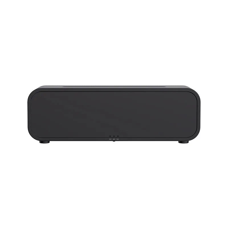 Black Flame Dynamic aroma diffuser with flickering light effect and remote control on a table.