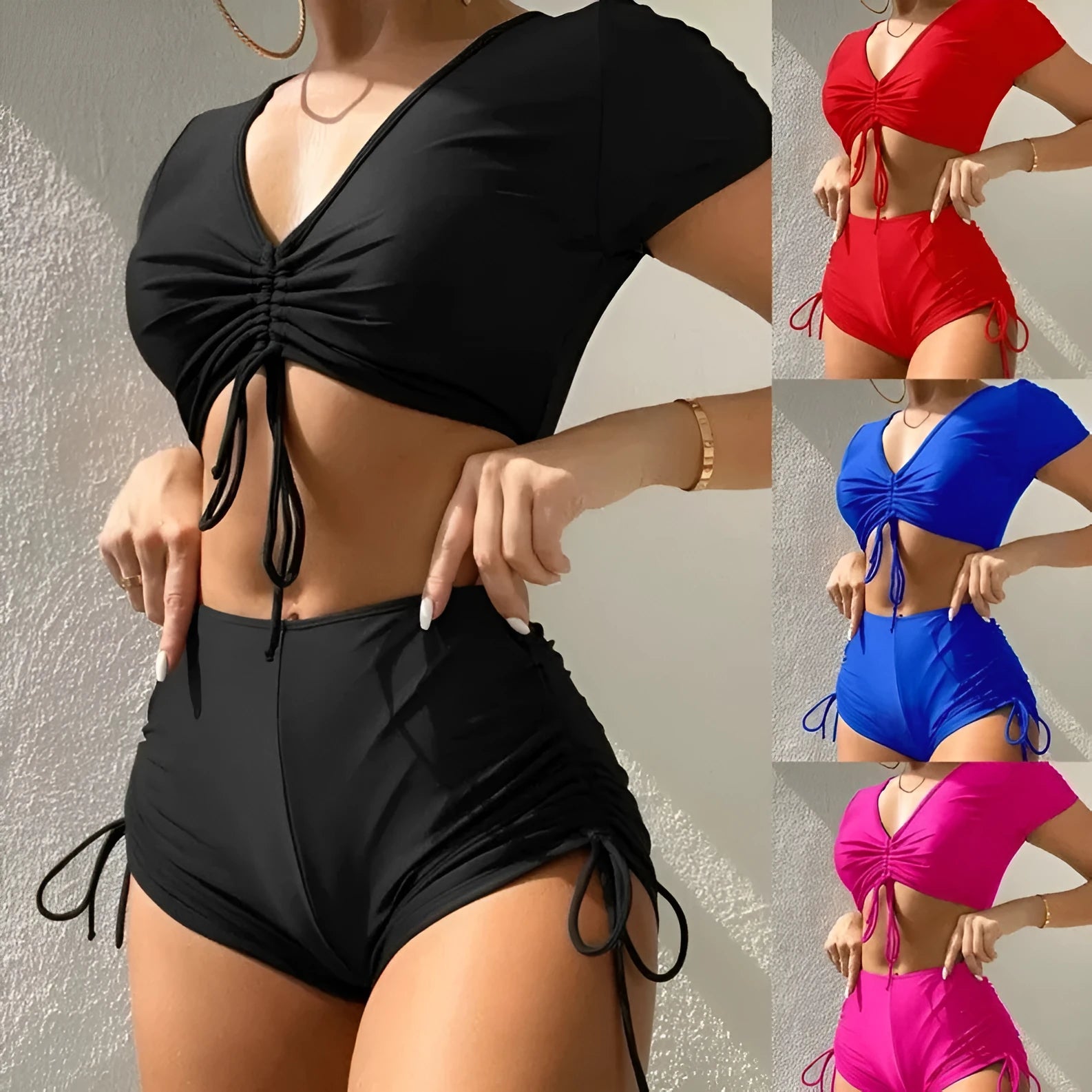 Lady's black lace-up bow two-piece swimsuit top and shorts set on a mannequin